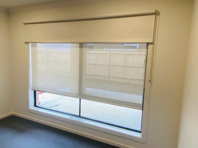 Indoor blinds in Melbourne featuring light-filtering roller blinds on a large window